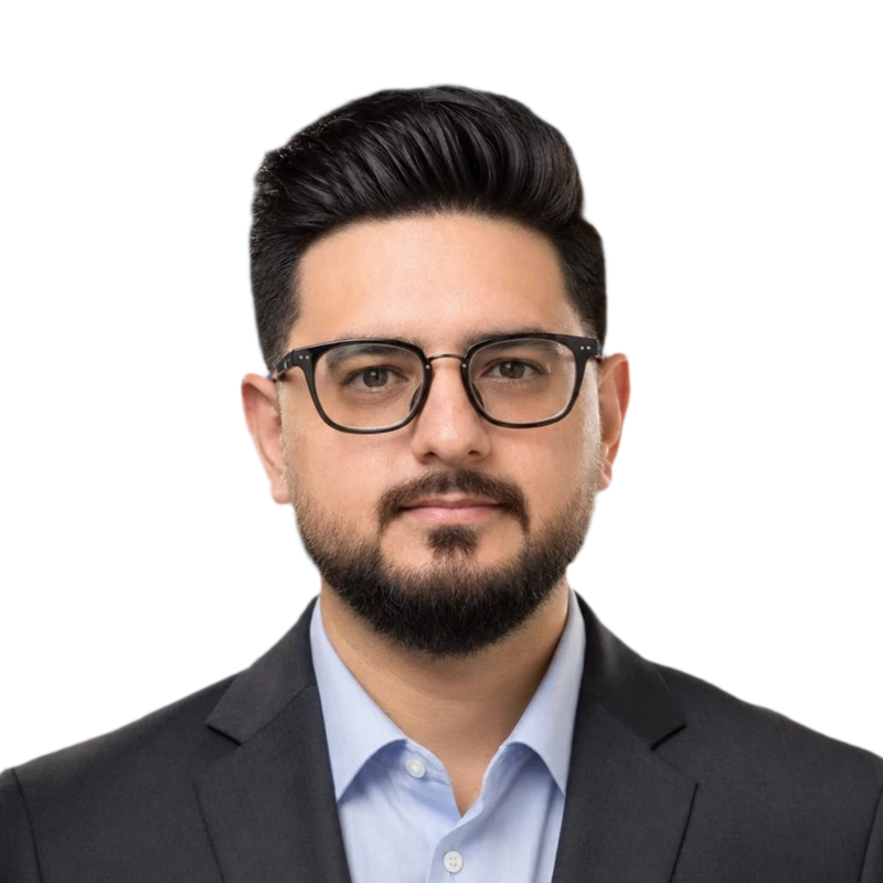 Shahzad Asghar, co-founder of FBA Venture, wearing glasses and a charcoal suit