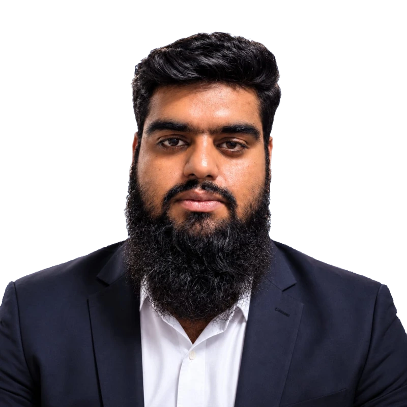 Ahmed Shah wearing a dark navy suit and white shirt