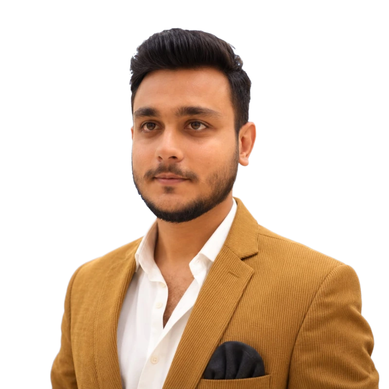Kamil Hanif wearing a tan jacket and open-collar white shirt